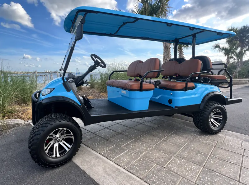 Caribbean blue golf cart with tan seats